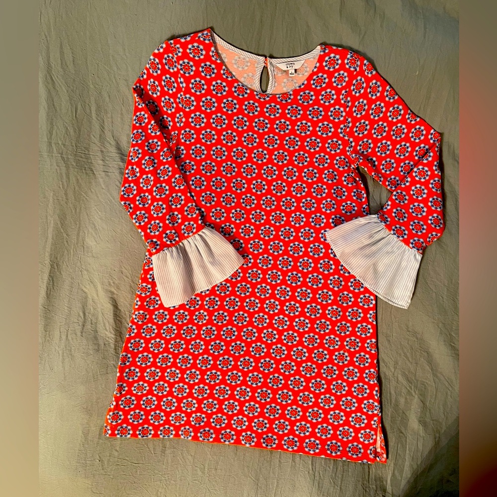 Girl’s orange and blue design dress size large excellent condition